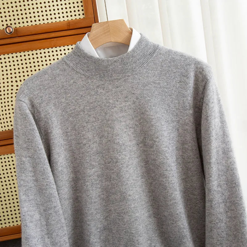 Man wearing a loose-fit half-collar wool sweater in a neutral colour for winter.