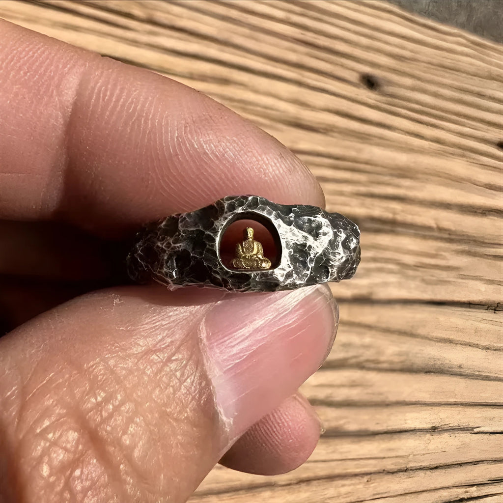 Hand-forged copper Grotto Buddha ring with rock texture finish showing size 8