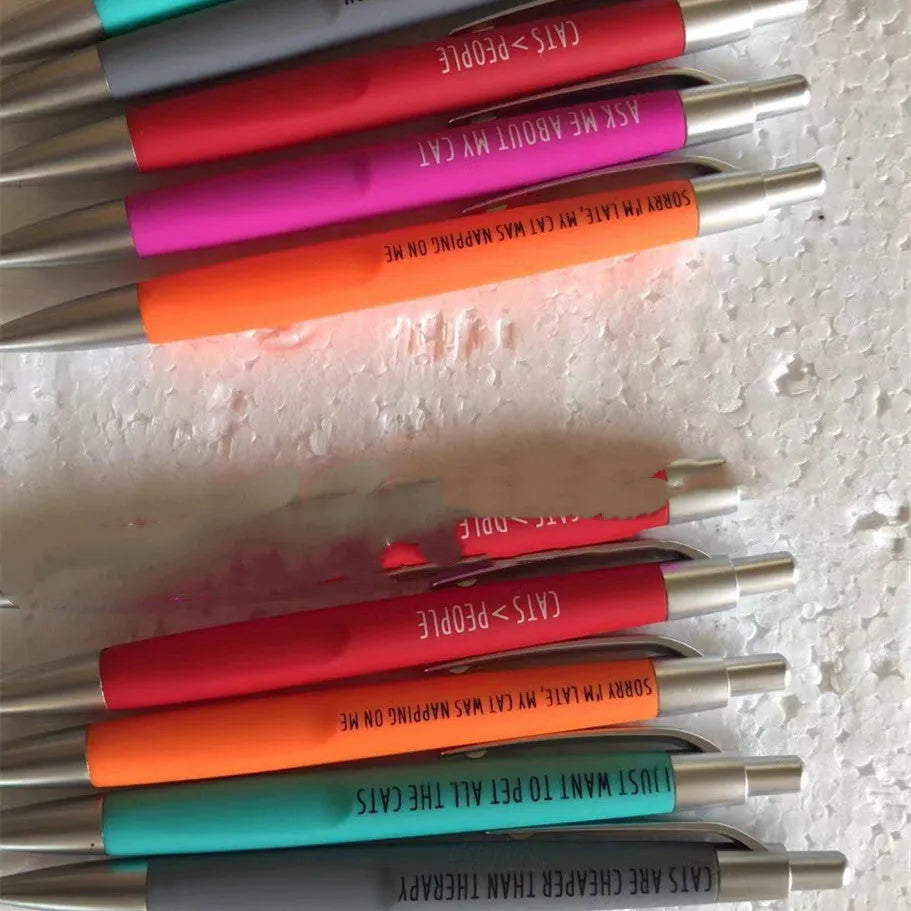 Set of five coloured push-action pens with cat or dog themes in beaded storage bag