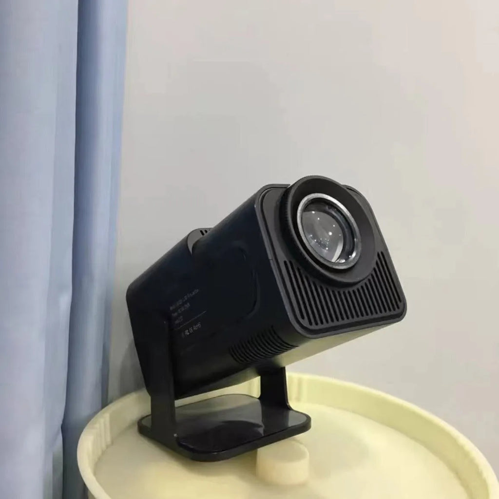 Wireless home gaming projector with HD 720p resolution displayed alongside gaming console