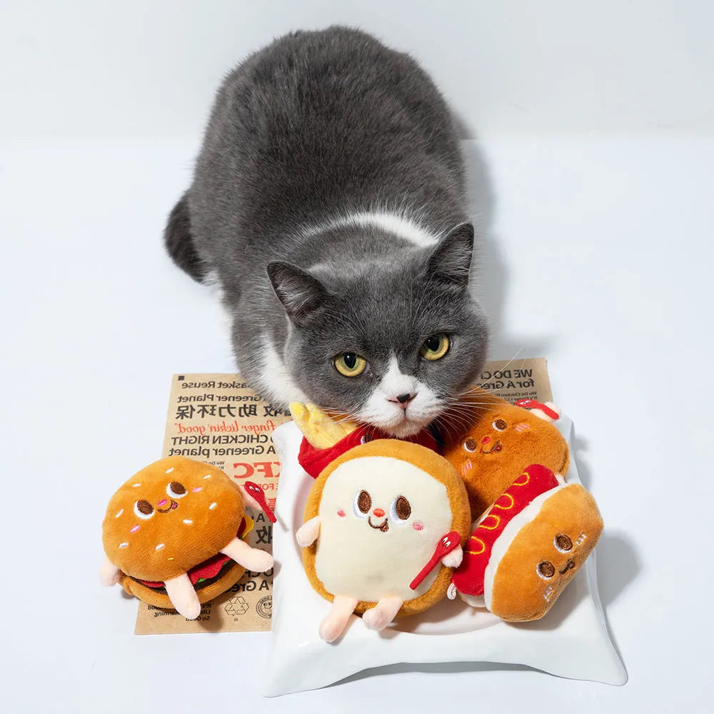 Set of soft cat chewing toys shaped like a chicken leg, hamburger, fries, hot dogs, and bread.