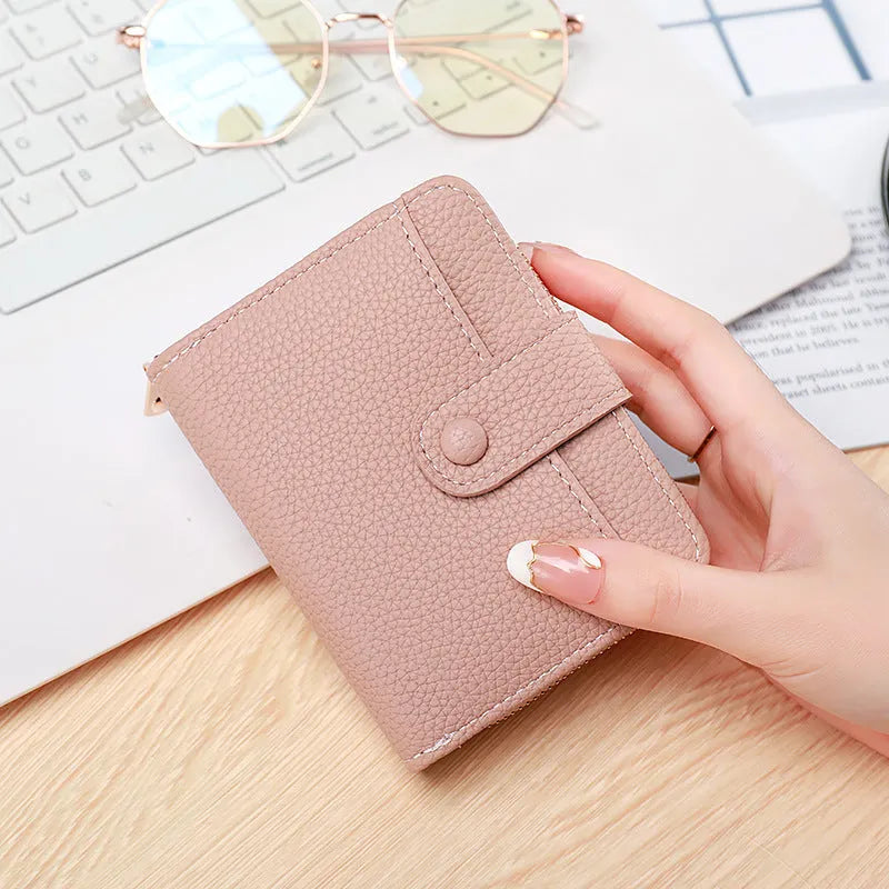 Women's lychee pattern PU leather short wallet showing card slots and cash compartment
