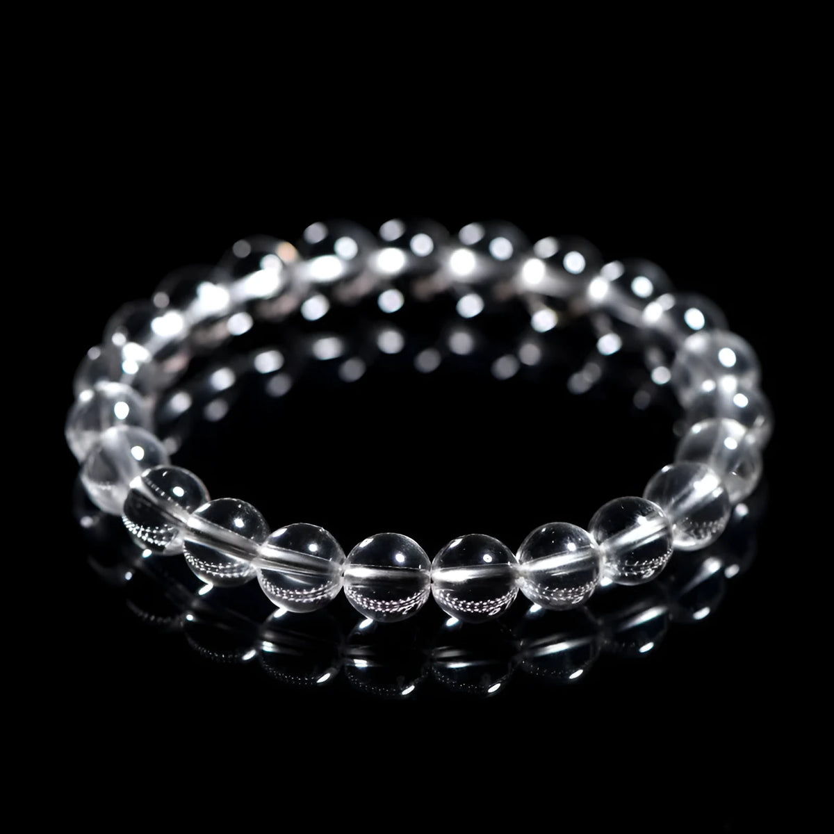 Natural white crystal bead bracelet with round beads on a single strand, geometric unisex design.
