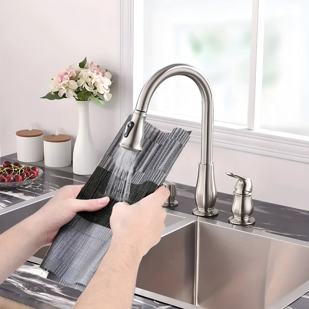 Modern PVC non-slip dish mat in gradient bamboo pattern placed in a kitchen sink.