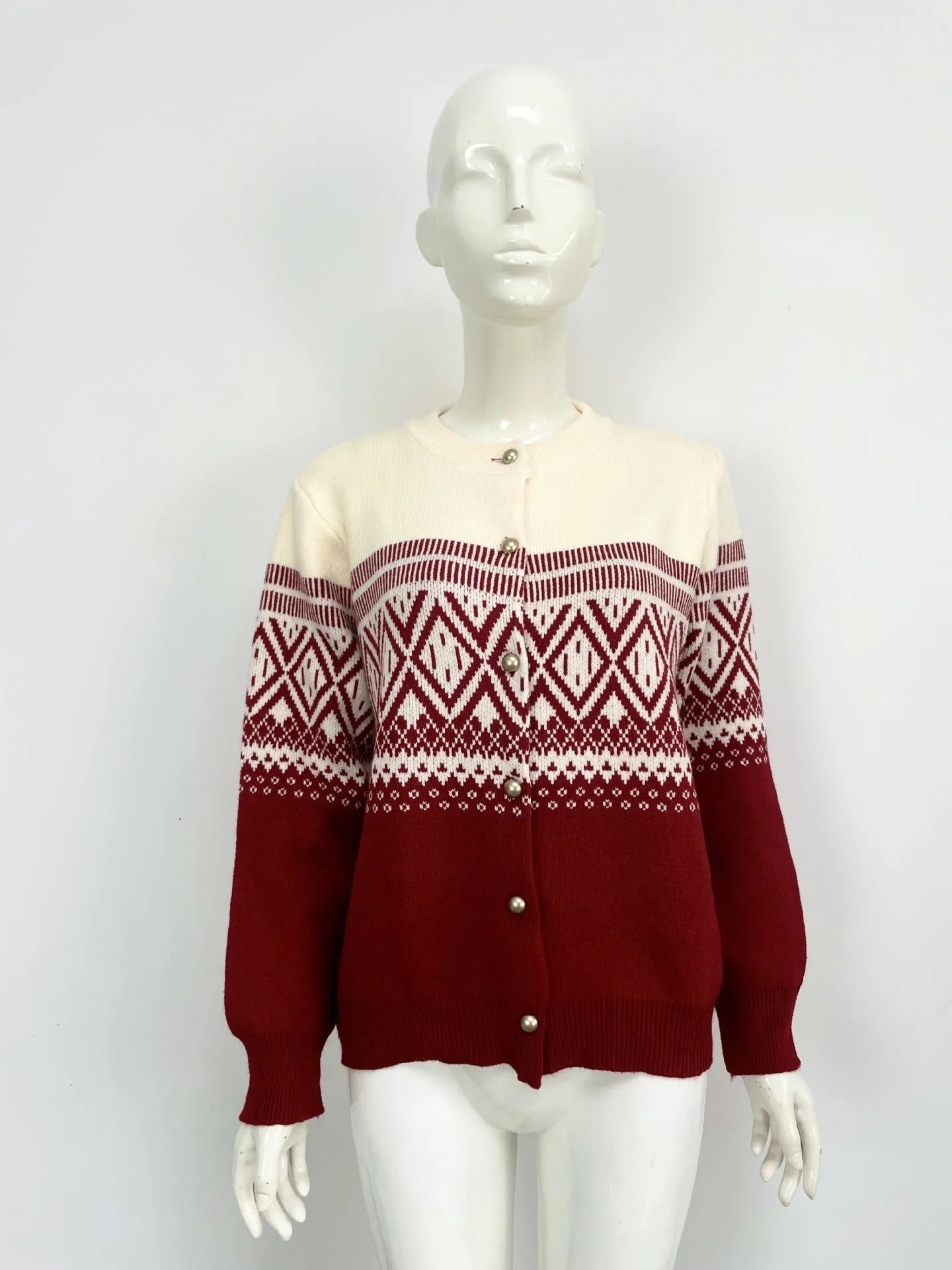 Women's grey alpaca wool cardigan with long sleeves and a diamond knit pattern in contrasting colours.