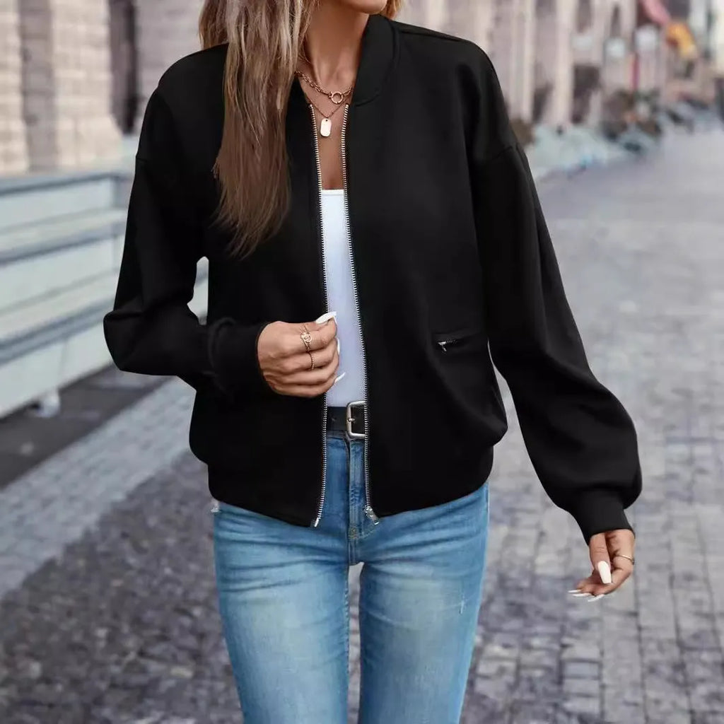 Black women's zip-front casual jacket with long sleeves and faux pocket detailing