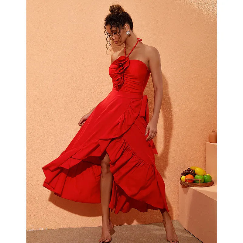 Red women's V-neck halter swimsuit with detachable flower and matching long skirt on a white background.