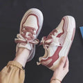 Women's pink and beige low-top height increasing sneakers with rubber soles