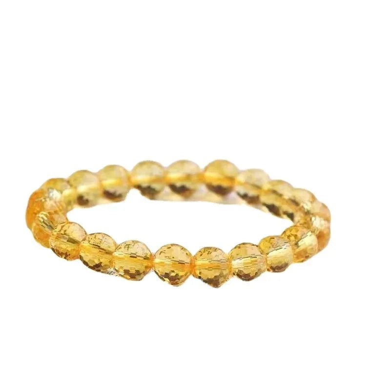 Hand-crafted ametrine bracelet with 128-facet cut crystal beads on a wrist.
