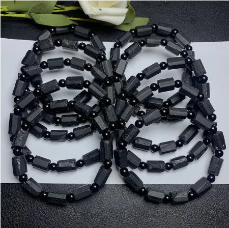 Natural black tourmaline rough stone bracelet with approximately 9mm beads and seiko polished finish