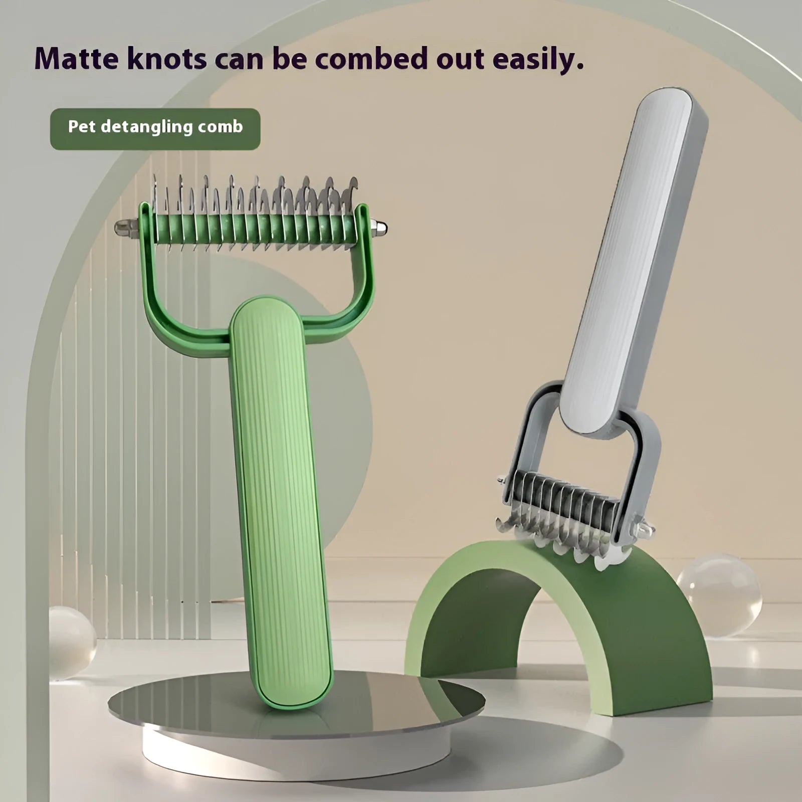 Green and grey pet hair unknotting comb for dogs in large and small sizes.