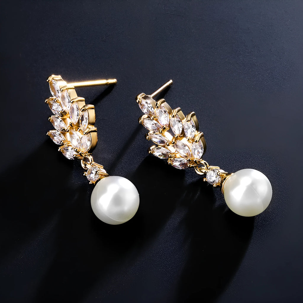 Geometric drop earrings with pearl and micro inlaid zircon, available in gold, platinum, and rose gold plating.