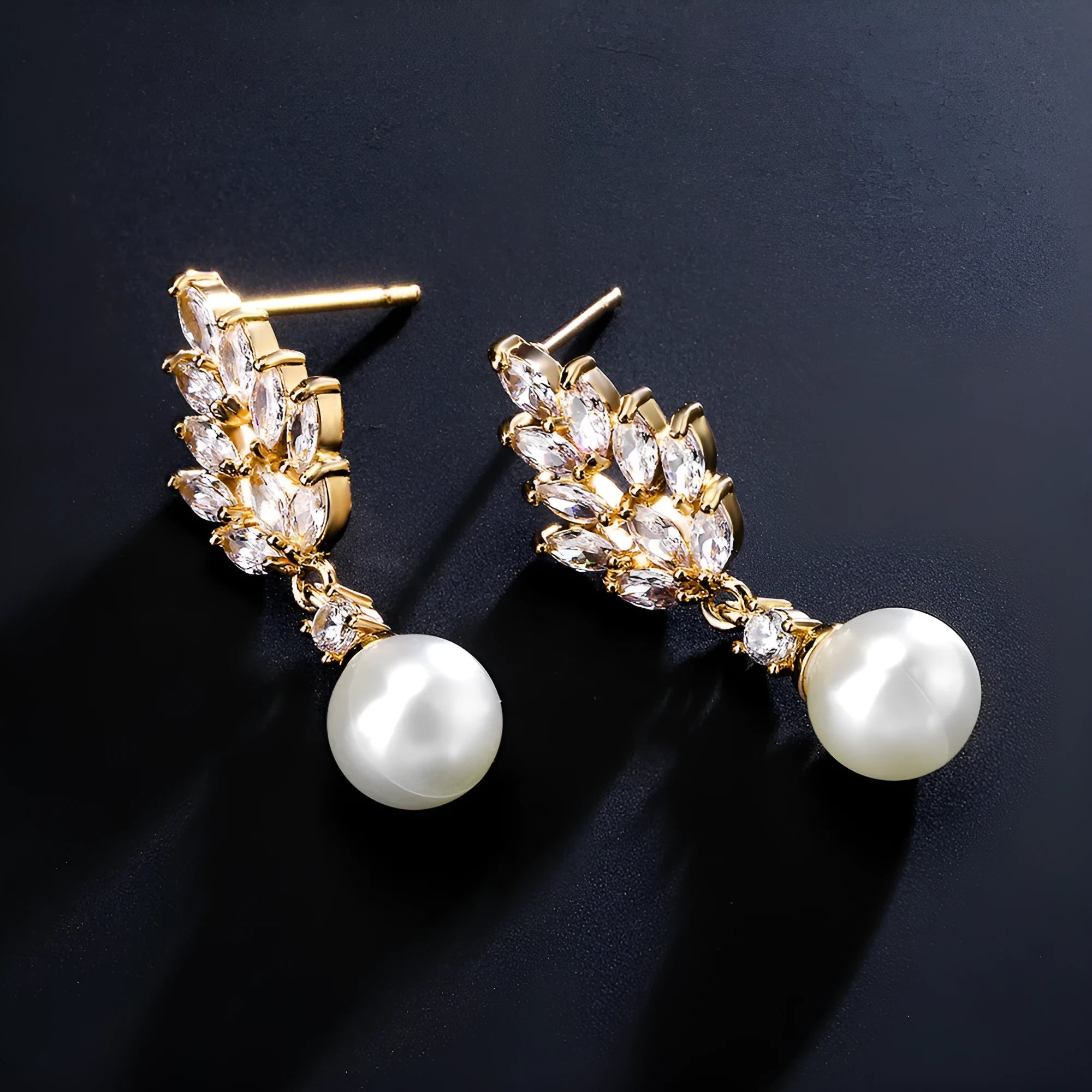 Geometric drop earrings with pearl and micro inlaid zircon, available in gold, platinum, and rose gold plating.