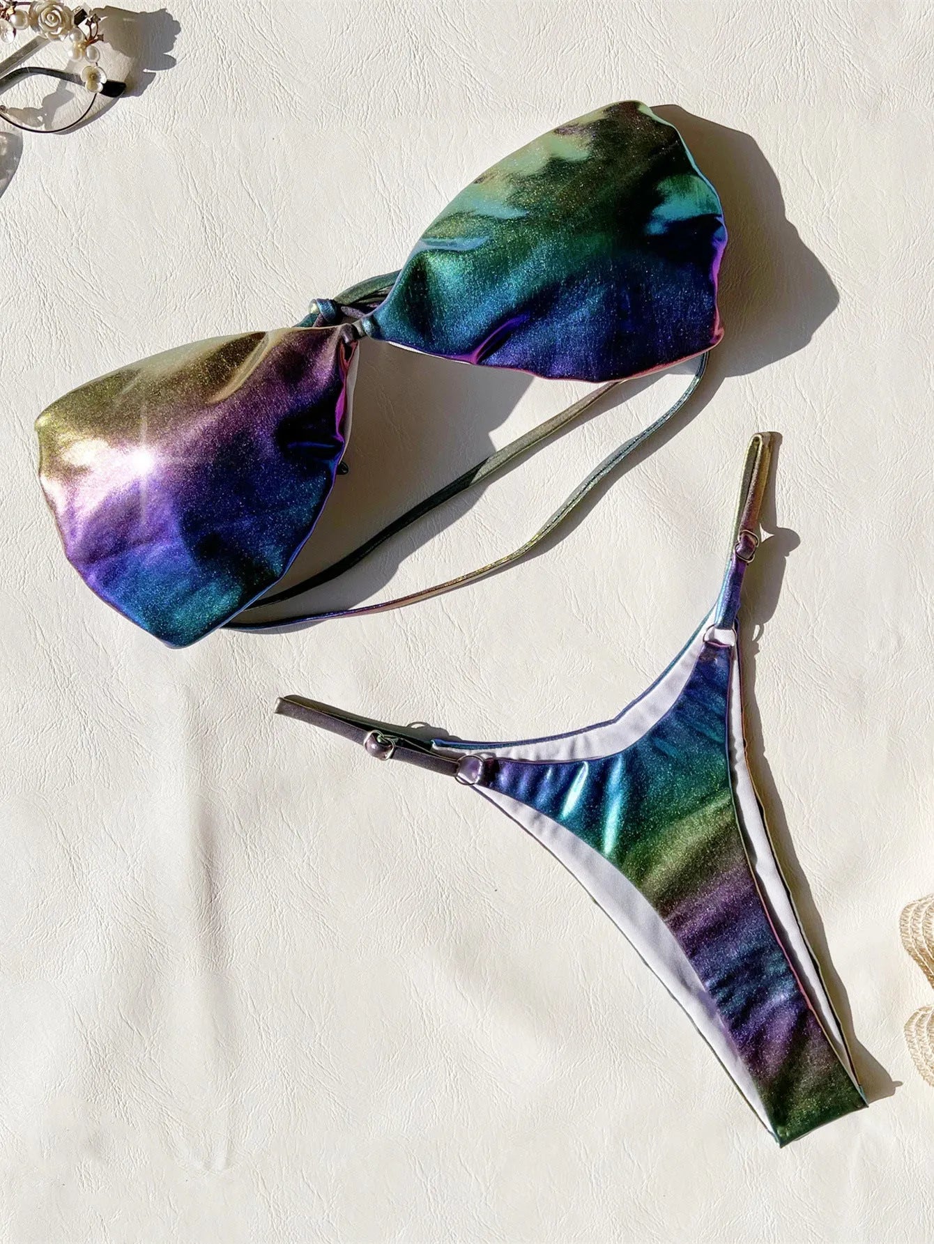 Women's gradient purple bikini swimsuit set on a white background.