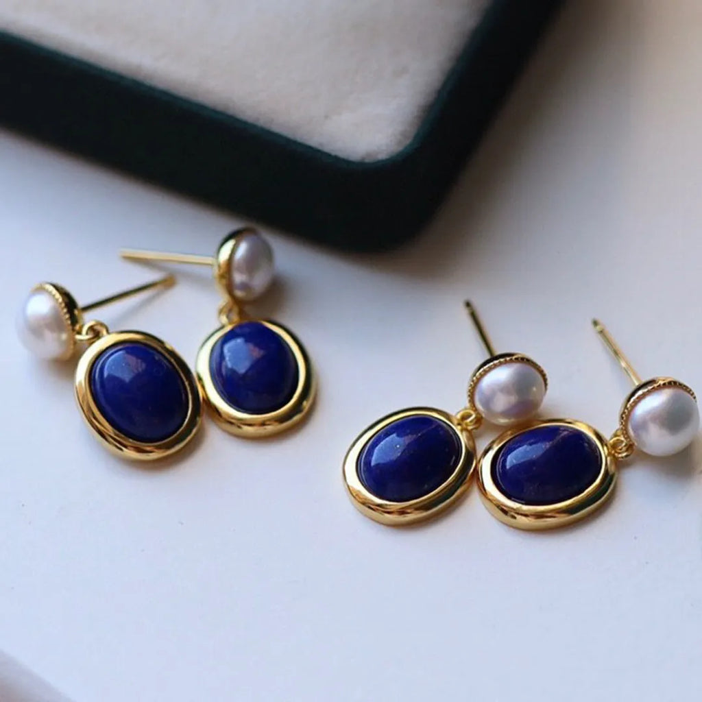 Simple drop earrings with a blue Lapis Lazuli pearl set in sterling silver, featuring auspicious pattern details.