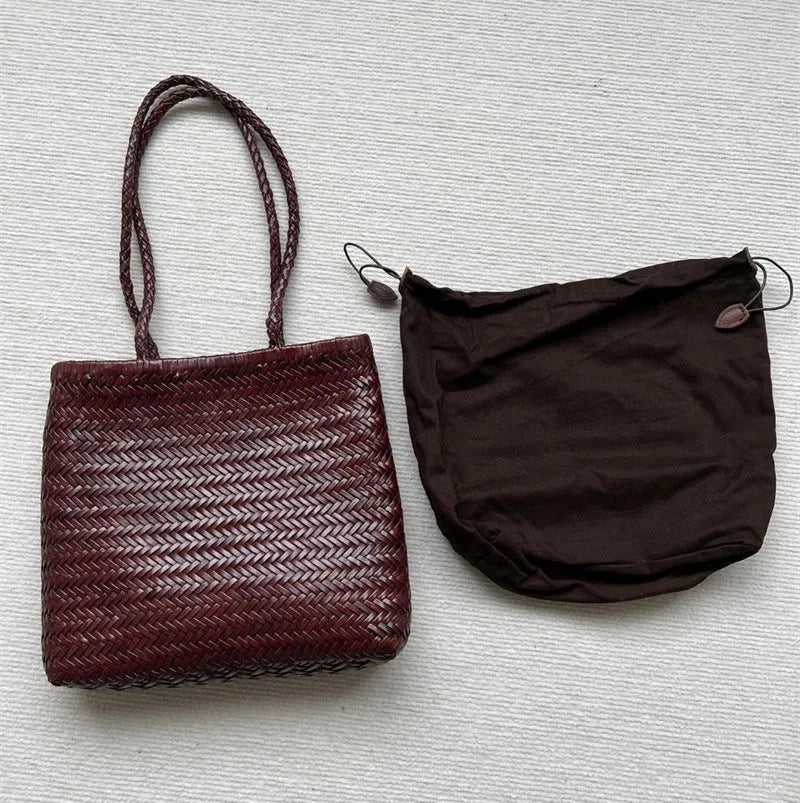Brown handmade woven tote bag with three-dimensional pocket design and cowhide leather construction