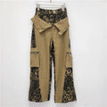 Women's retro high waist straight leg jeans with leopard print pattern on dark khaki denim and tooling style details