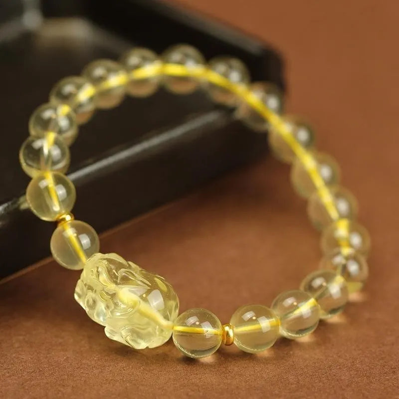 Yellow leather cord bracelet with a citrine artificial crystal Pi Xiu charm pendant
