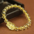 Yellow leather cord bracelet with a citrine artificial crystal Pi Xiu charm pendant
