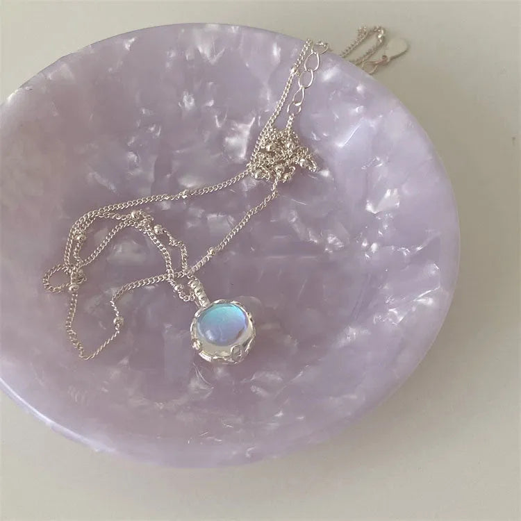 Women's sterling silver geometric stone pendant necklace on a curb chain, adjustable length.