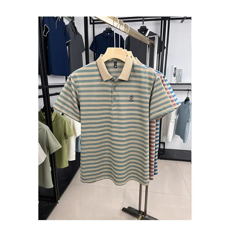 A man wearing a blue striped short sleeve casual top with a mosaic pattern design.