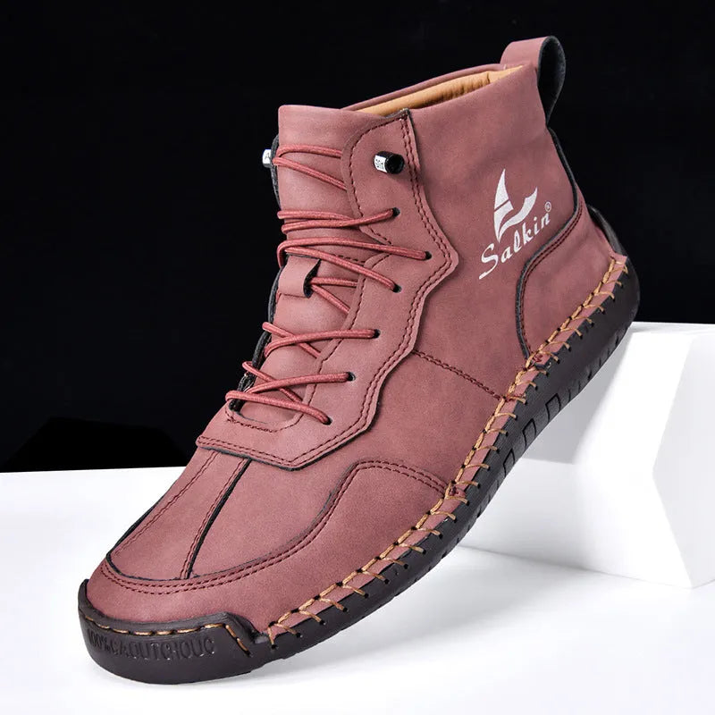 Men's dark blue retro high-top casual boots with lace-up front and elastic band on a white background.