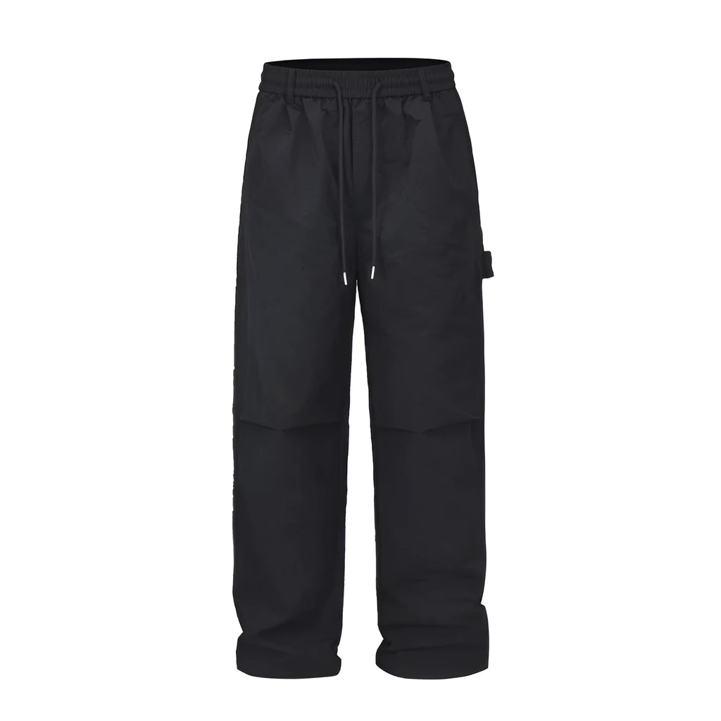 Black baggy paratrooper trousers with elastic drawstring waist and three-dimensional cutting