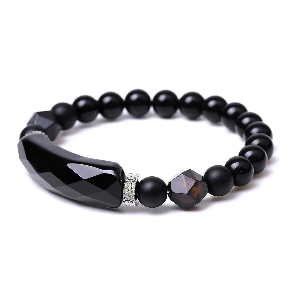 Diamond-shaped cut black agate bracelet showing geometric fan design and handmade craftsmanship