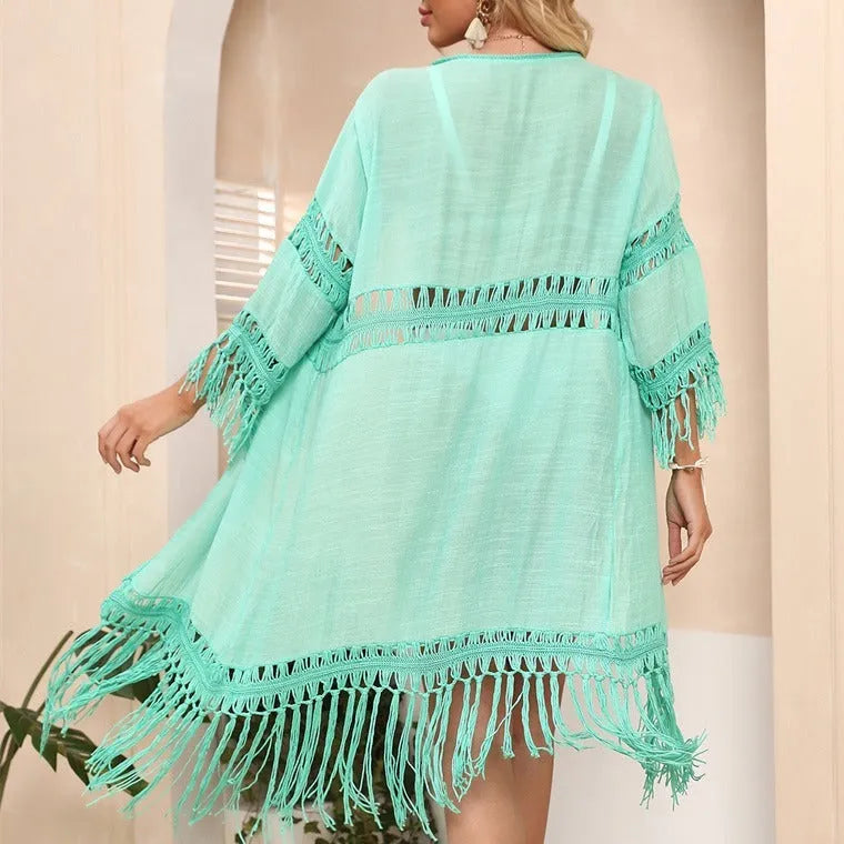 Hand crocheted loose fit beach cardigan in water green with tassel trim.