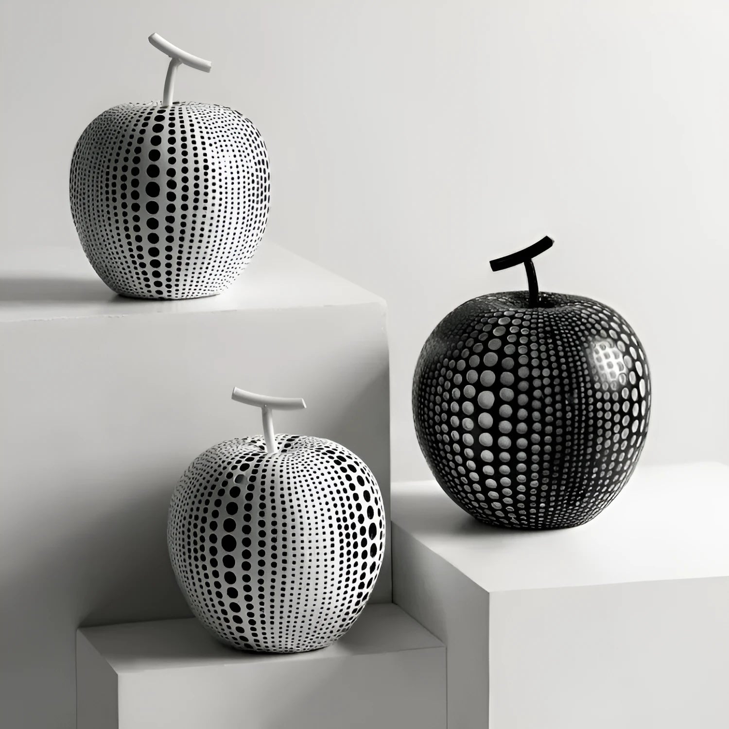 Resin decorative apples and pears in white, orange, black and blue colour options