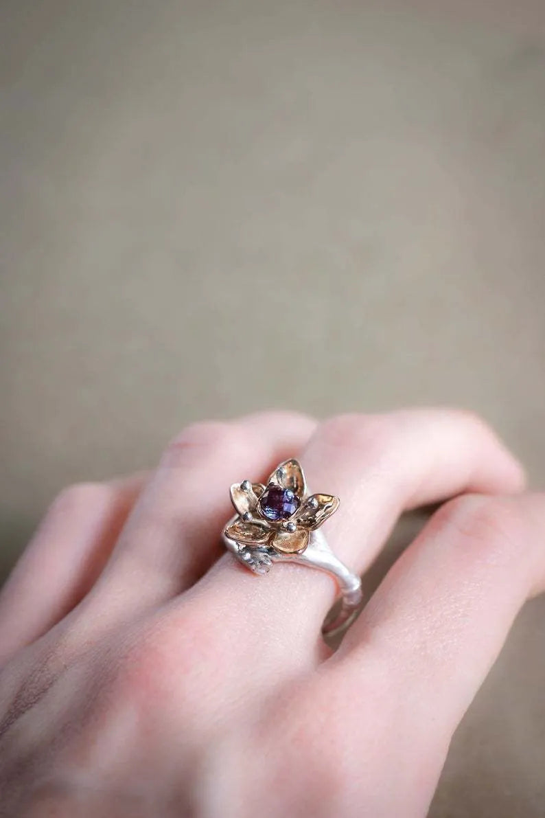 Silver two-tone floral geometric alloy ring showing detailed patterning