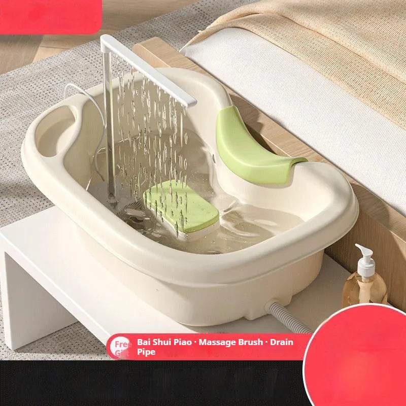 Light pink lying down hair wash basin with head pad, neck pillow, water pump and hair washing accessories