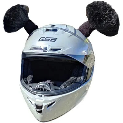 A pair of decorative balls for helmet customisation with non-marking adhesive, shown next to a full-face motorcycle helmet.