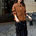 Women's longline brown suede-look polyester coat on a hanger, showing regular sleeves.