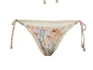 Women's floral pattern bikini set with briefs and matching skirt in creamy-white colour