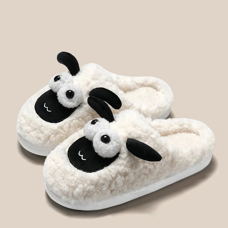 A pair of lamb thermal cotton slip-on slippers with a suede upper and sewn PVC sole.