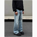 Men's blue retro straight-leg jeans with whisker washing detail on the thighs, showing a flared wide-leg cut.