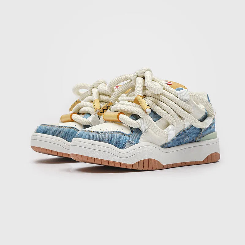 Unisex casual lace-up shoes with thick rubber soles in denim blue colour showing round toe and low-top design