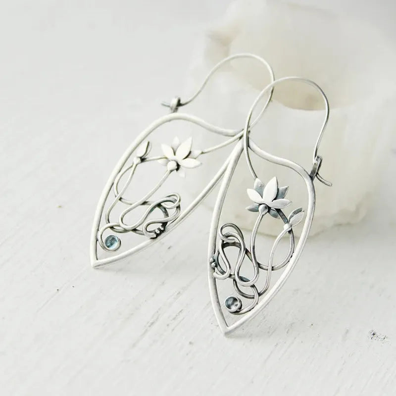 Silver lotus flower earrings with rhinestones on geometric alloy setting