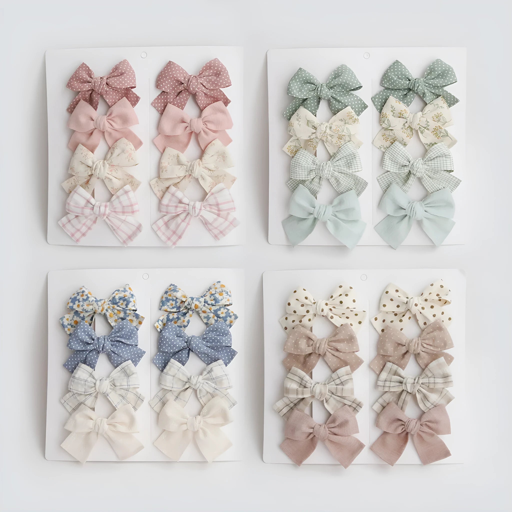 Set of children's cloth hair clips with a dovetail bow design in various colours.
