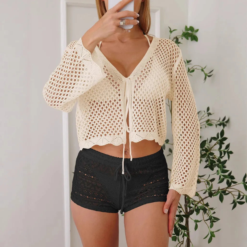 Women's apricot hollow woven cardigan blouse with bell sleeves laid flat showing 40cm length