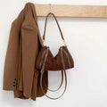 Vintage matte cowhide Boston bag in khaki or mocha coffee, 34x16x21cm, with shoulder and crossbody strap and outer pocket.