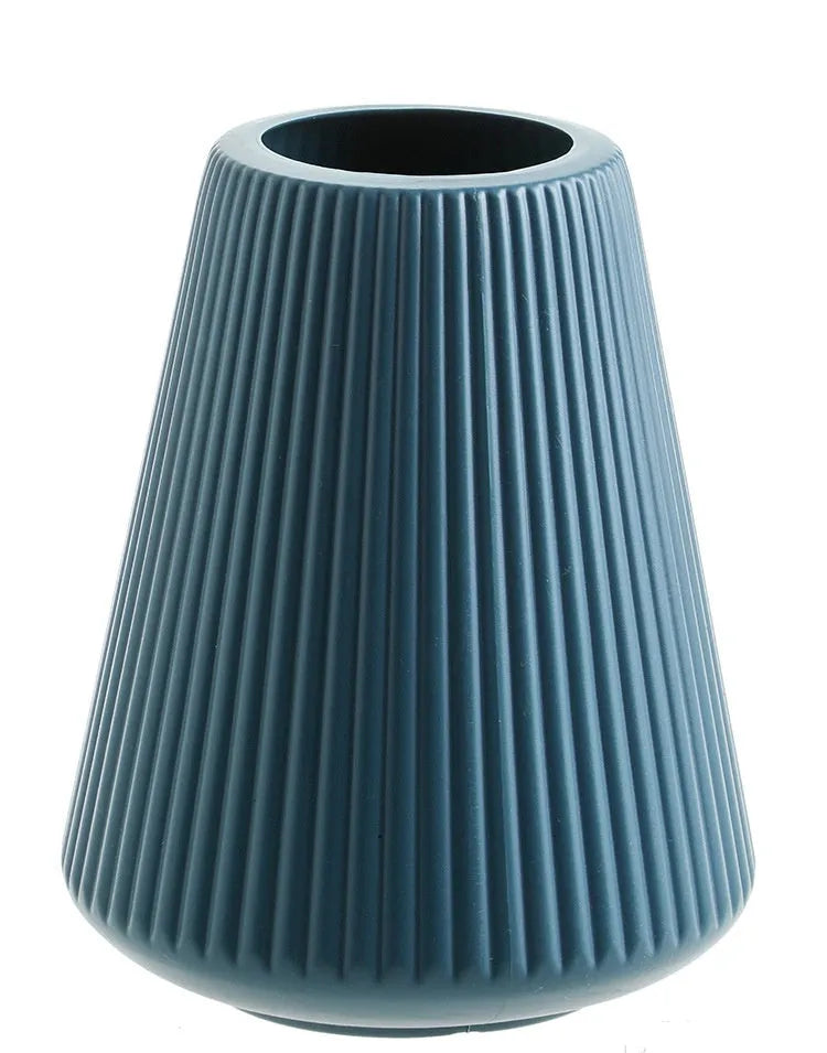 Melamine plastic decorative flower vase in four colours on desktop