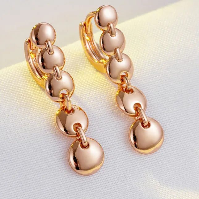 Retro gold-coloured copper circle earrings with woven texture and long dangle design