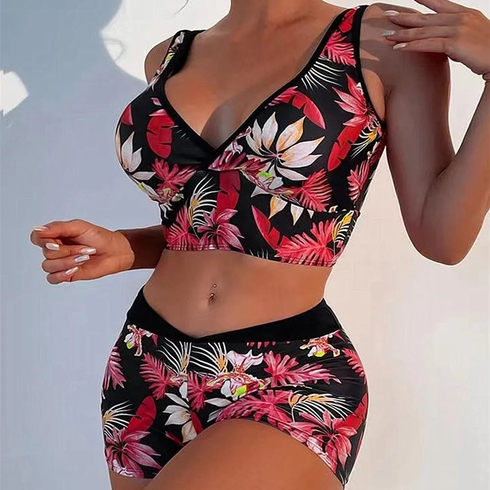 Women's two-piece printed swimsuit set with a sleeveless top and boxer-style briefs in a multicolour pattern.