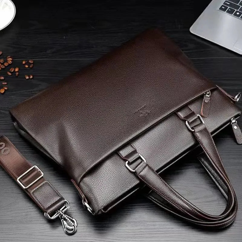 Men's black PU leather business messenger bag with spliced design shown from the side.