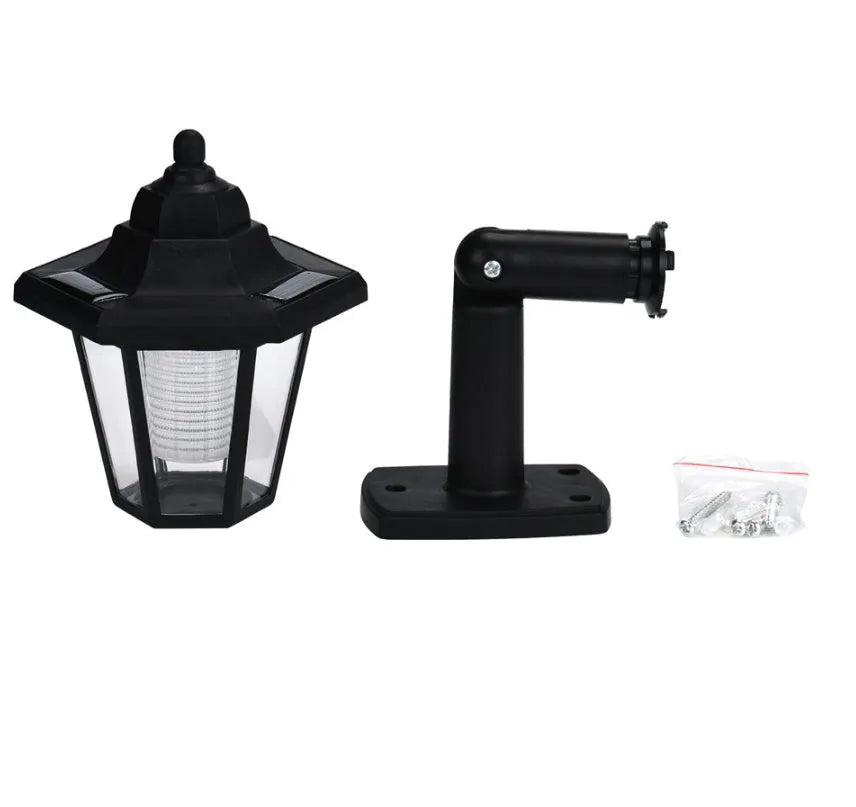 Black hexagonal solar-powered LED wall light for outdoor garden and security lighting
