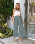 Women's high-waist pleated casual trousers in cotton linen, cropped straight-leg style.