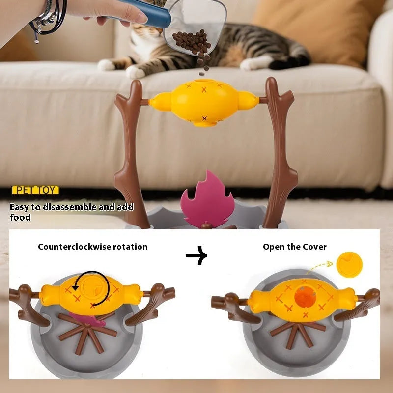 Barbecue style plastic cat toy with tumbling food feeder for treat dispensing.