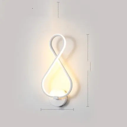 LED wall lamp with silicone shade in black or white finish showing button switch control